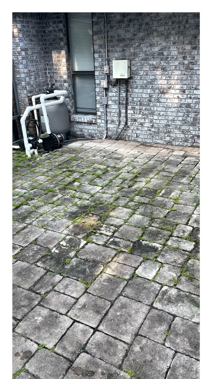Pool equipment patio before pressure washing
